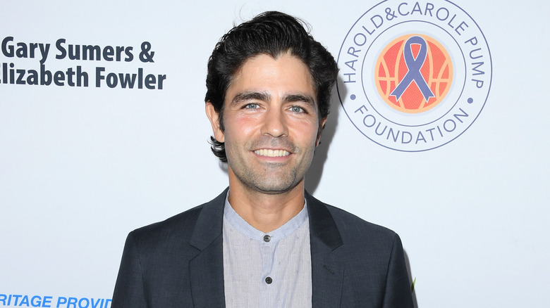 Adrian Grenier smiling at the Harold & Carole Pump Foudnation Gala in 2023