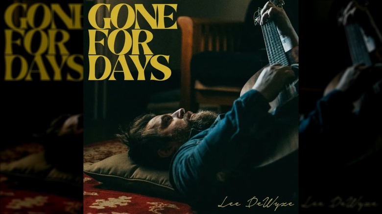 The album cover for Lee Dewyze's album Gone For Days, depicting the singer on his back playing guitar