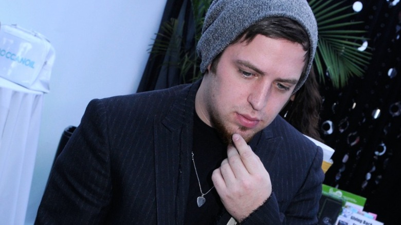 Lee DeWyze stroking his chin, looking concerned