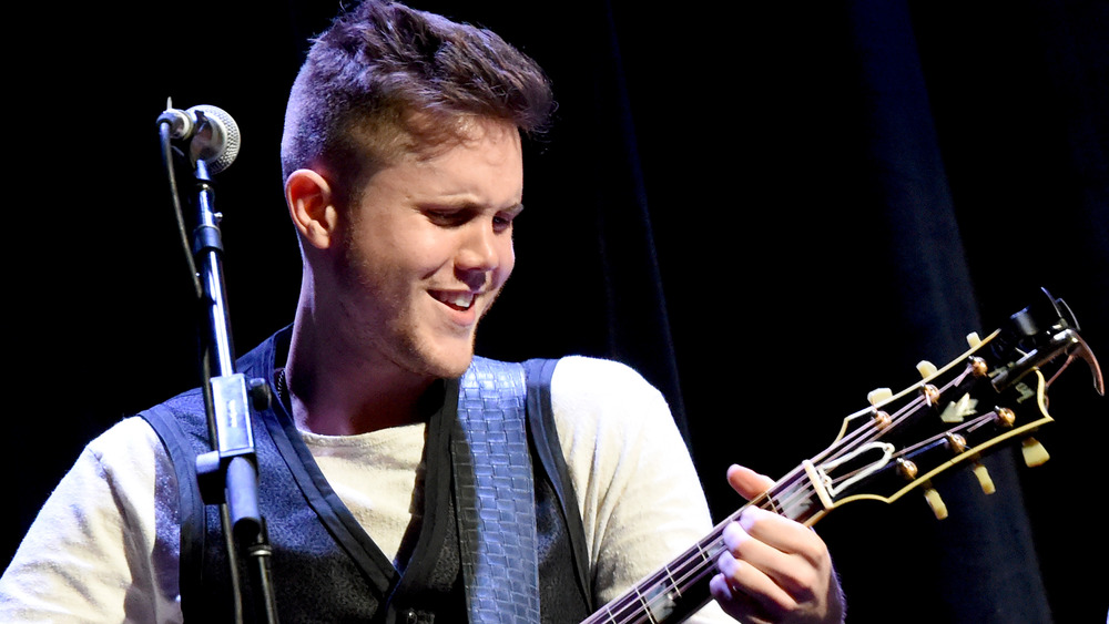 Trent Harmon playing guitar on stage 