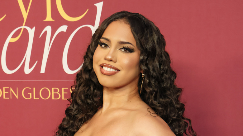 Asia Monet Ray posing at an event in 2025