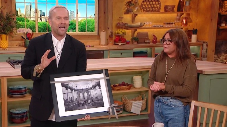 Bob Harper holding a photo of the Brooklyn Bridge on Rachael Ray's show