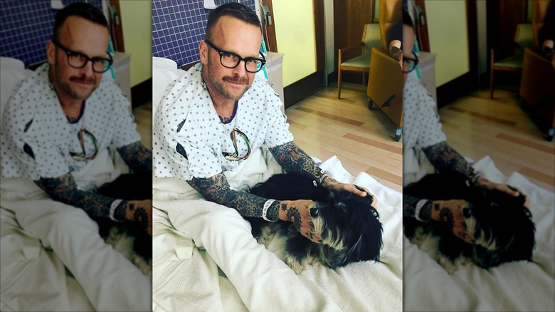 Bob Harper in a hospital bed with his dog Karl