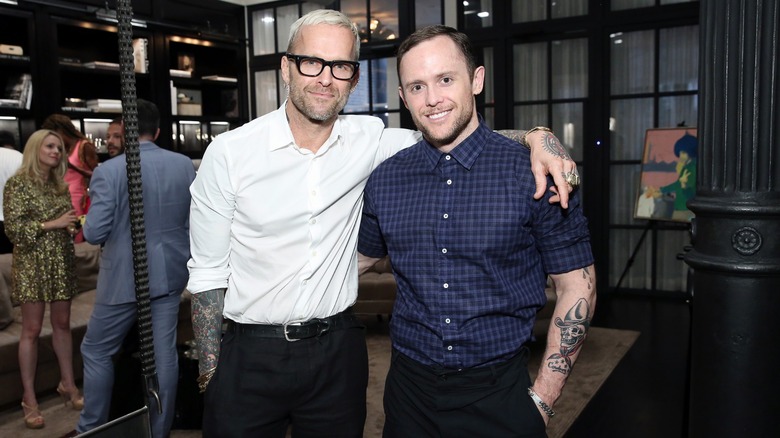Bob Harper with his arm around Anton Gutierrez at an event