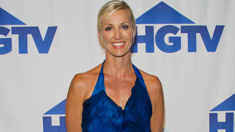 Candice Olson smiling in front of HGTV backdrop