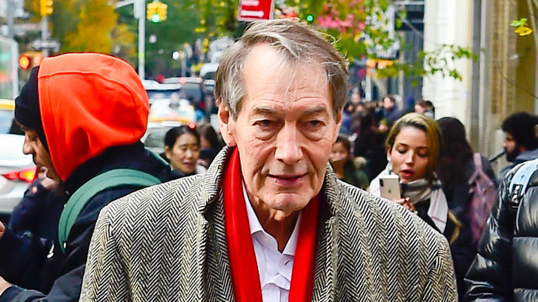 Charlie Rose walking in the street