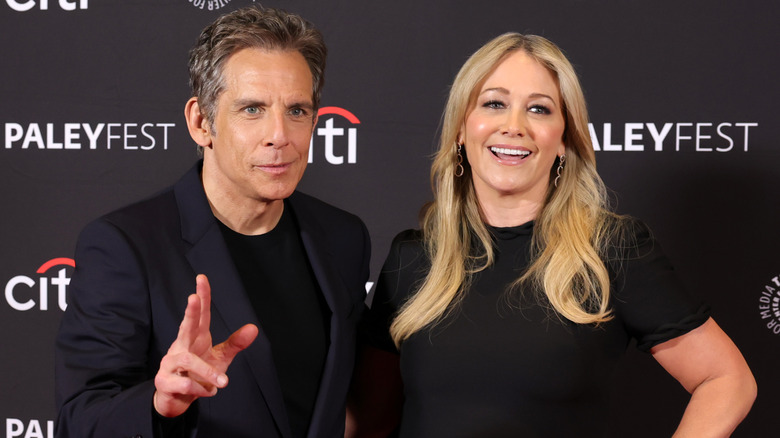 Christine Taylor and Ben Stiller laughing on a 2025 red carpet
