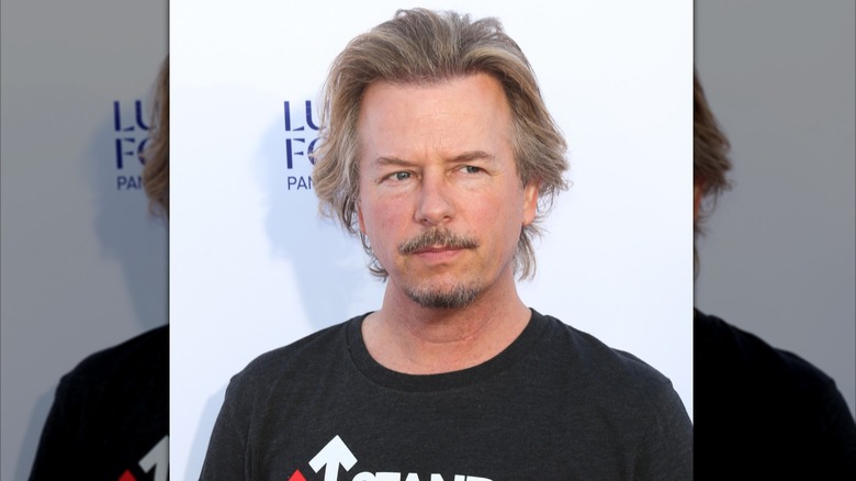 David Spade posing at a Stand Up to Cancer event