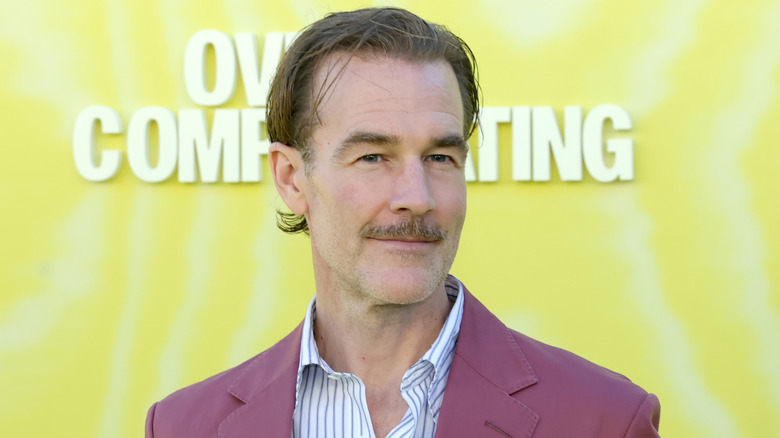 James Van Der Beek in front of yellow backdrop