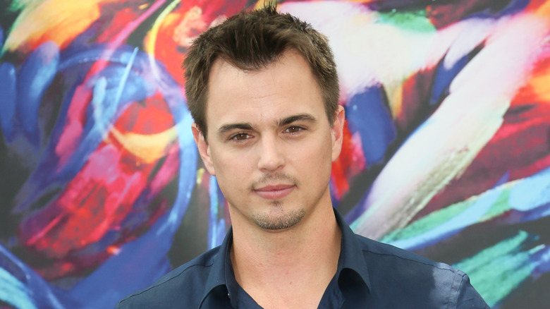 Darin Brooks posing for a photo. 