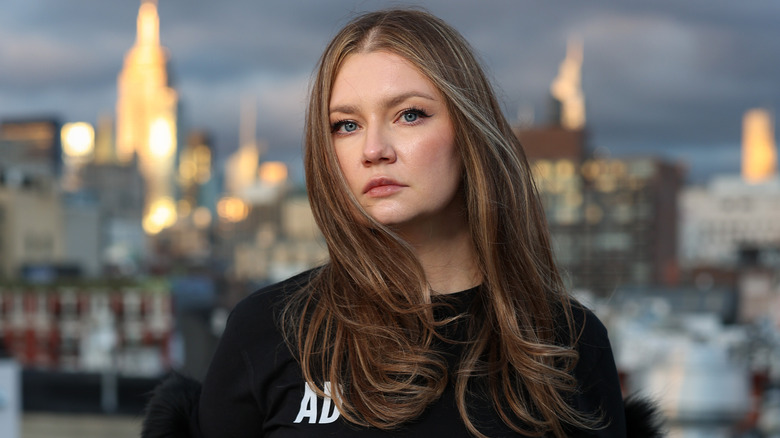 Anna Delvey looking serious outside