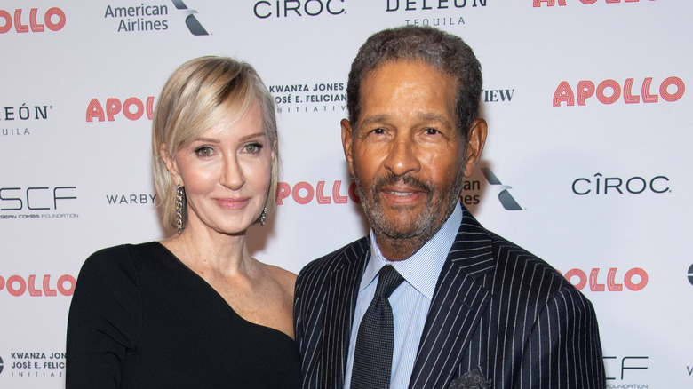 Bryant Gumble and Hilary Quinlan posing at an event