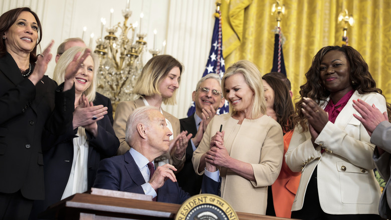 Gretchen Carlson smiling with President Joe Biden and others