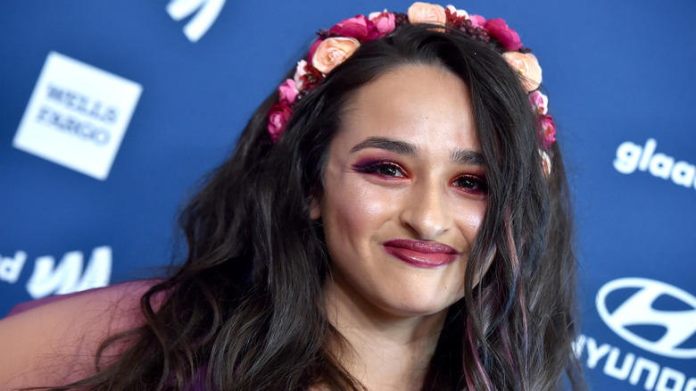 Jazz Jennings smiles in a close up photo wearing a floral crown