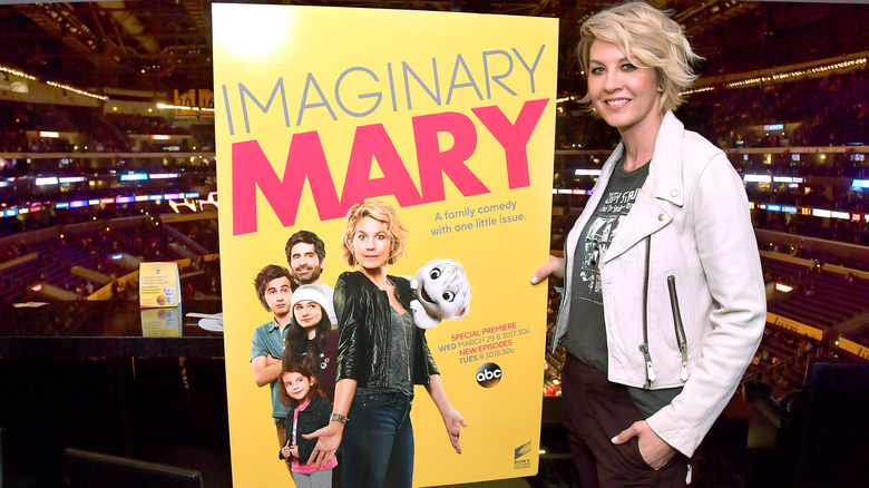 Jenna Elfman posing next to poster for ABC's "Imaginary Mary" in 2017