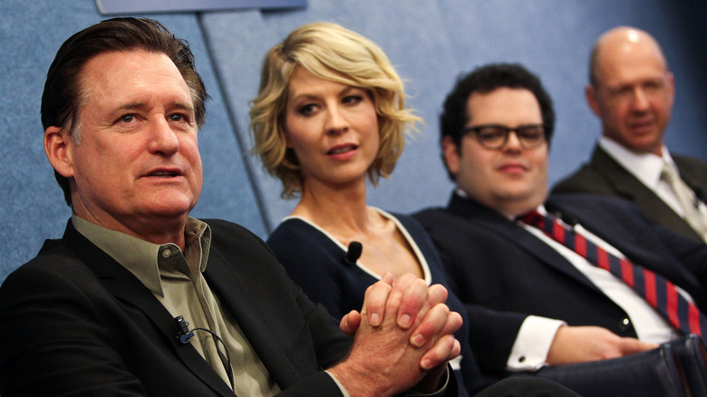 The cast of sitcom "1600 Penn" talking during a 2013 panel