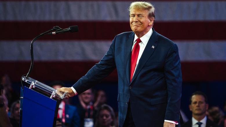 Donald Trump speaking about Joe Biden at the podium in 2024