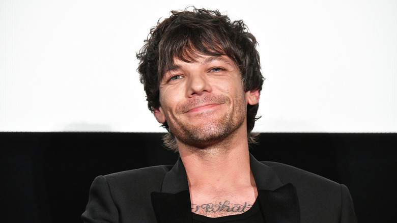 Louis Tomlinson smiling