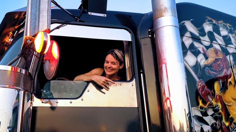 Lisa Kelly leans out of her truck window.