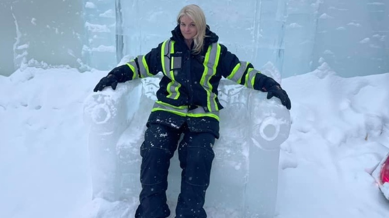 Lisa sits in a throne made of ice.