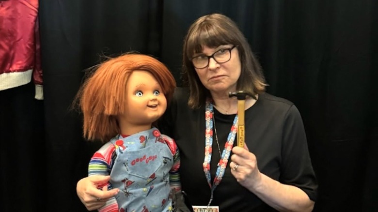 Dinah Manoff posing with Chucky from Child's Play