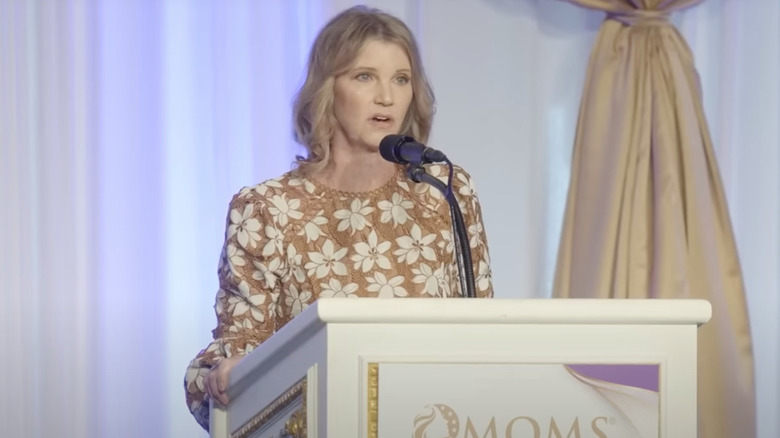 Missy Robertson speaking at a podium in 2024