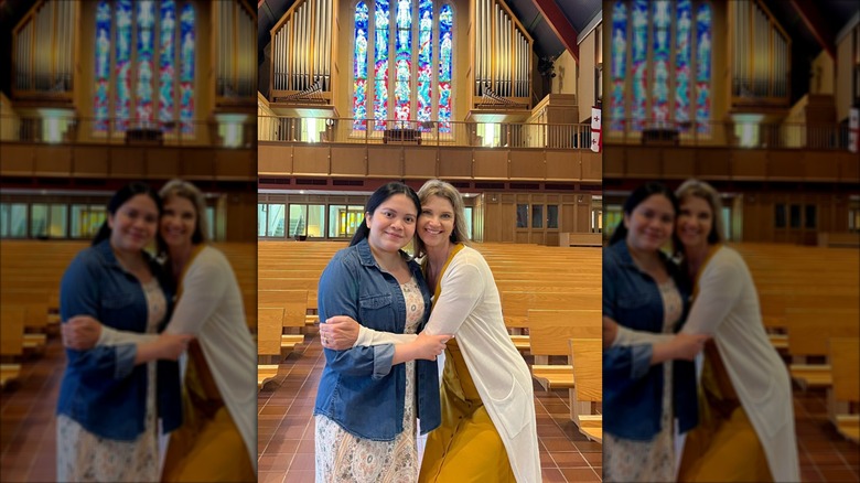 Missy Robertson posing with Karina in a church