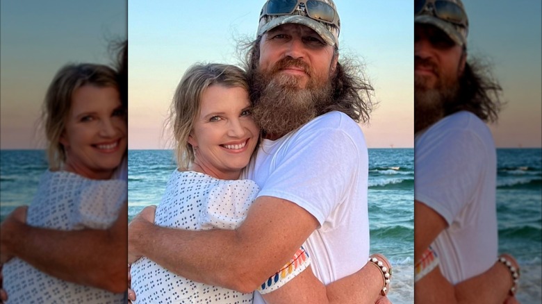 Missy and Jase Robertson hugging each other on a beach in 2024