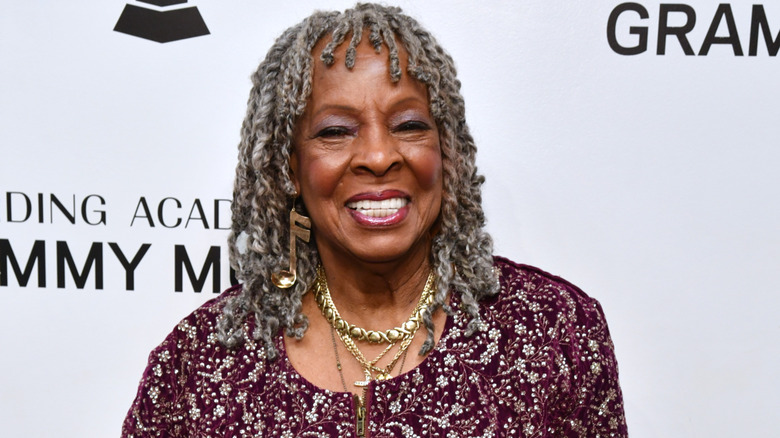 Martha Reeves wearing an earring that looks like a musical note