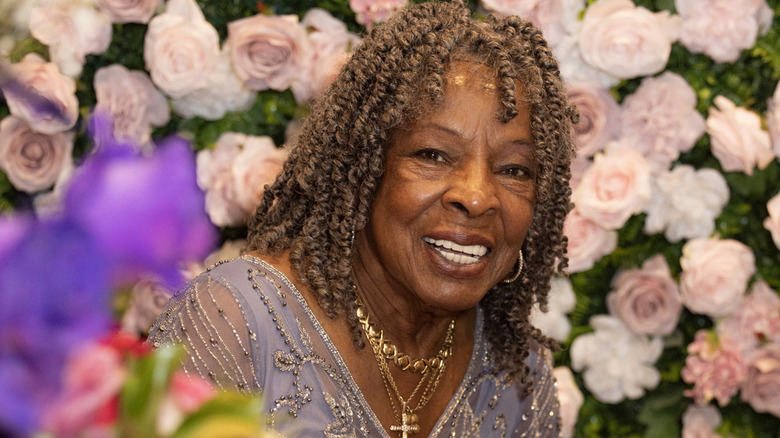 Martha Reeves surrounded by flowers