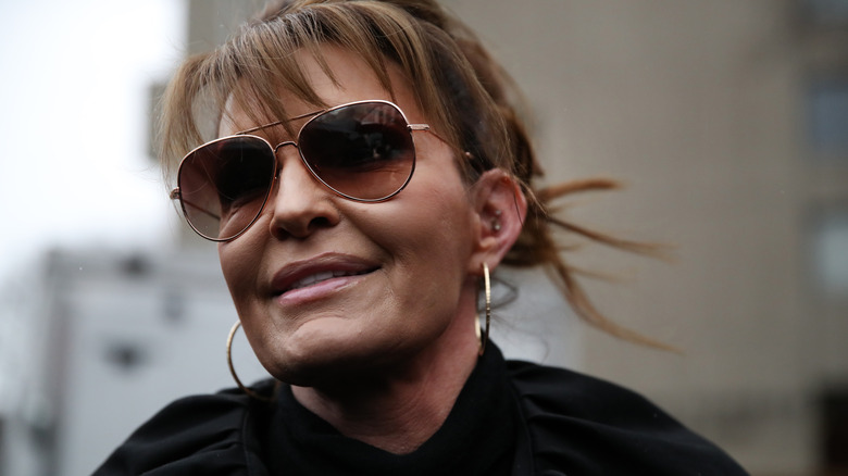 A close-up of Sarah Palin in 2022, smiling off to the side