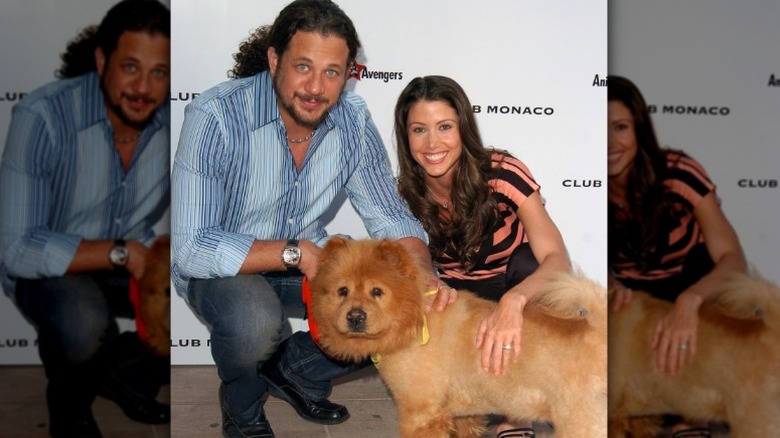Joe Reitman and Shannon Elizabeth pictured with a dog