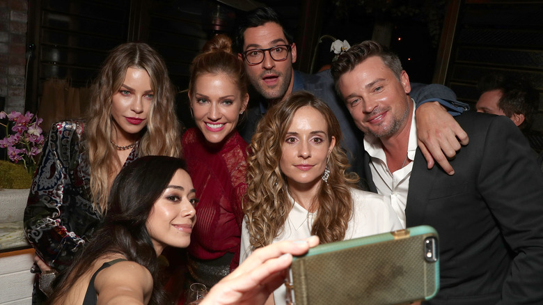 Tom Welling and Lucifer cast taking a selfie at a cast party