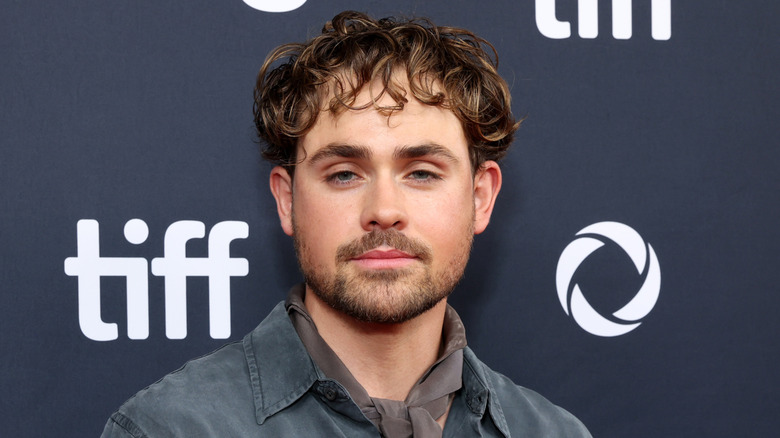 Dacre Montgomery posing at an event