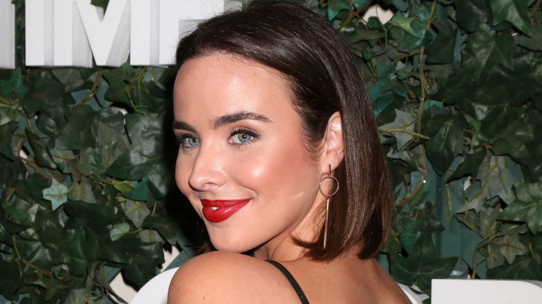 Ashleigh Brewer smiling over shoulder