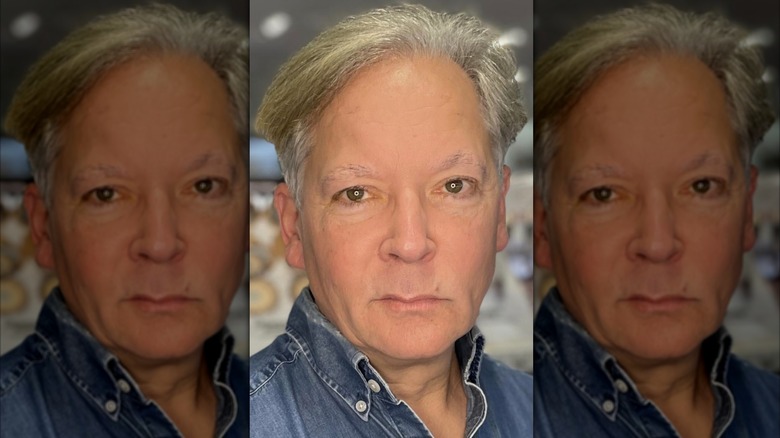 Actor Timothy Williams in close-up looking serious.
