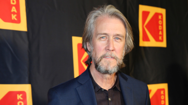 Alan Ruck in a blue suit jacket