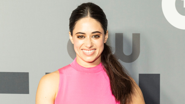 Jeanine Mason wearing a pink top