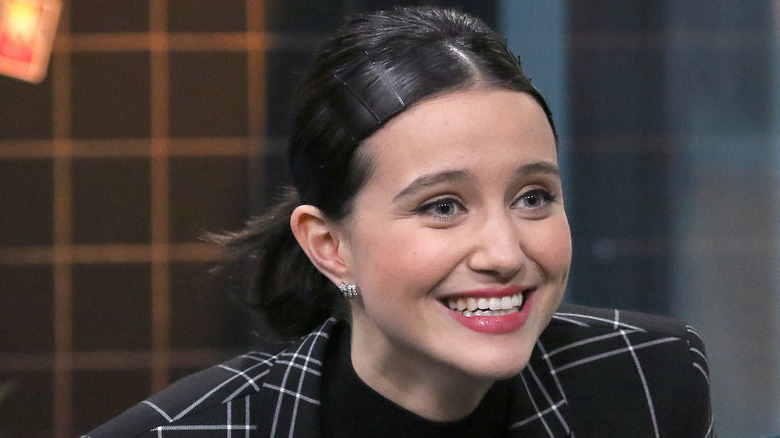 Julia Goldani Telles grinning during an interview