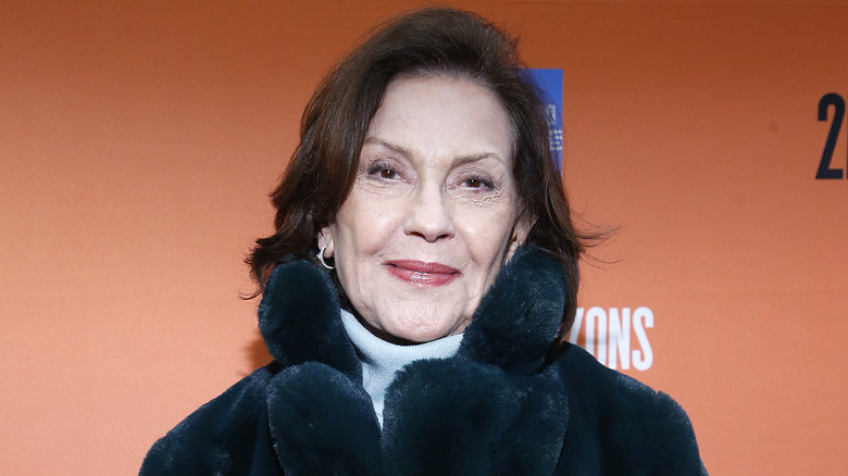Kelly Bishop wearing a fur coat