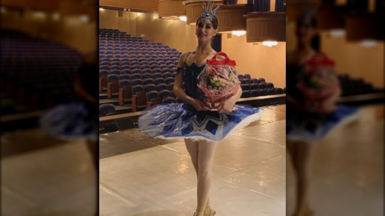 Mattise Love holding a bouquet of flowers