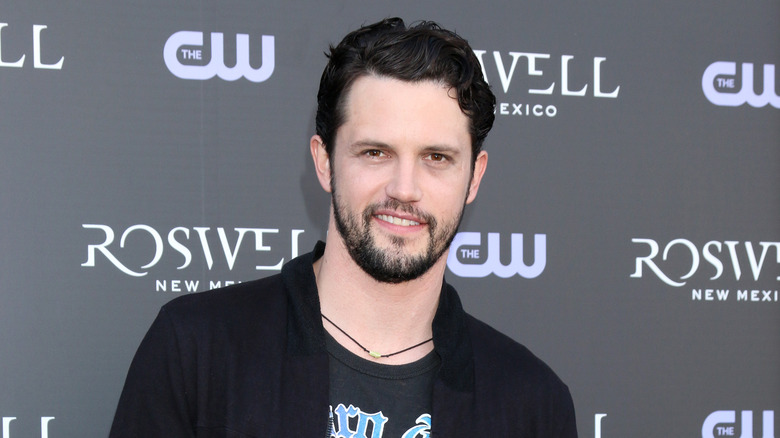 Nathan Parsons wearing black