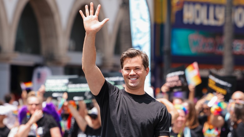Andrew Rannells smiling and waving during L.A. Pride in 2025