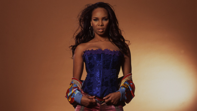 Cherie Johnson in a blue corset