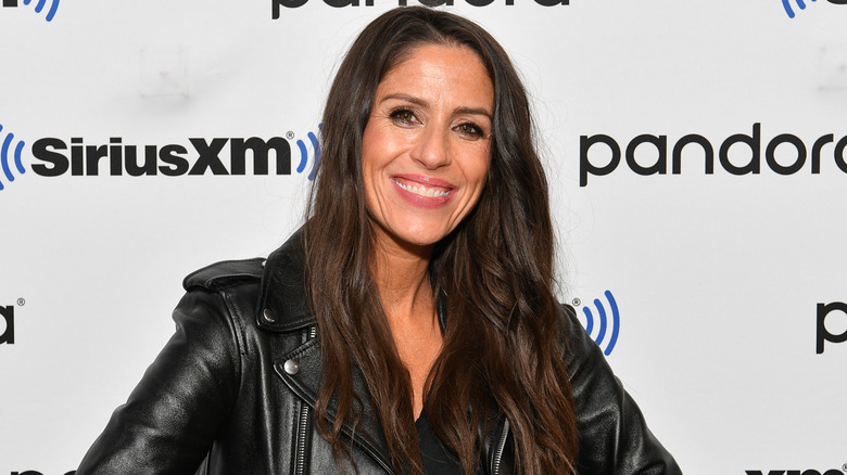 Soleil Moon Frye wearing a leather jacket