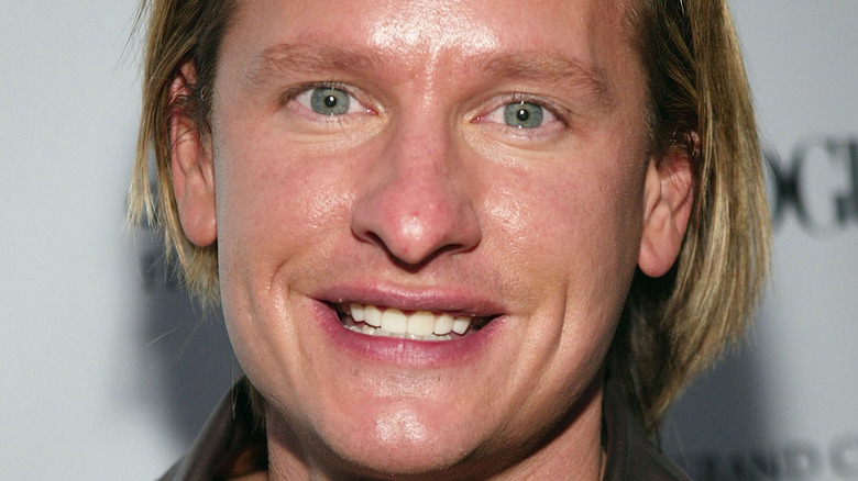 Carson Kressley smiling on the red carpet