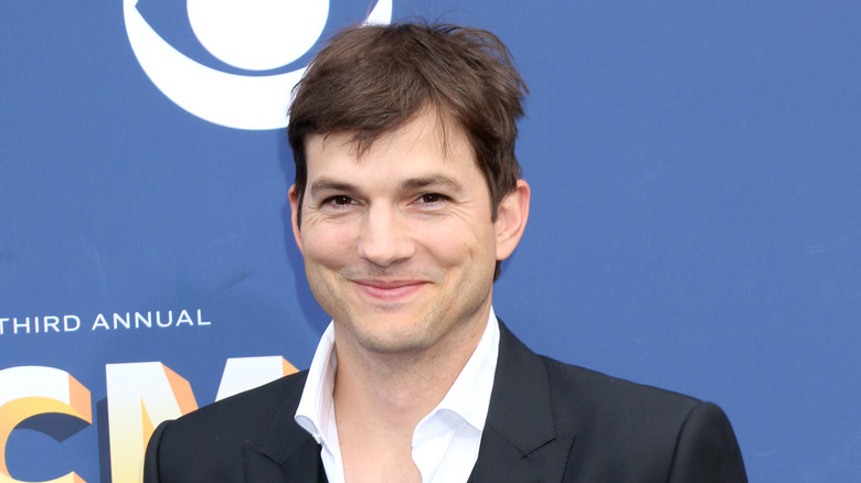 Ashton Kutcher smirking