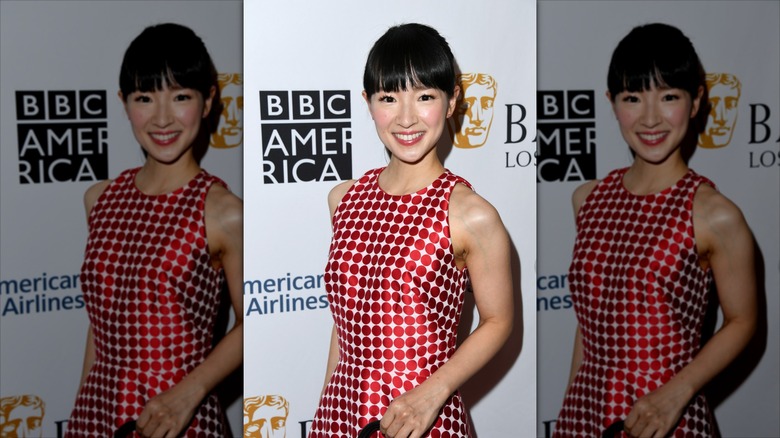 Marie Kondo in a red polka dot dress on a BBC America step and repeat