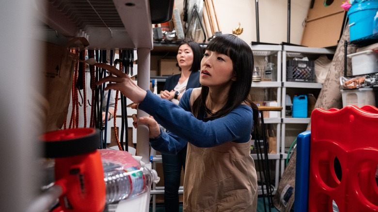 Marie Kondo going through someone's garage, from Sparking Joy on Netflix