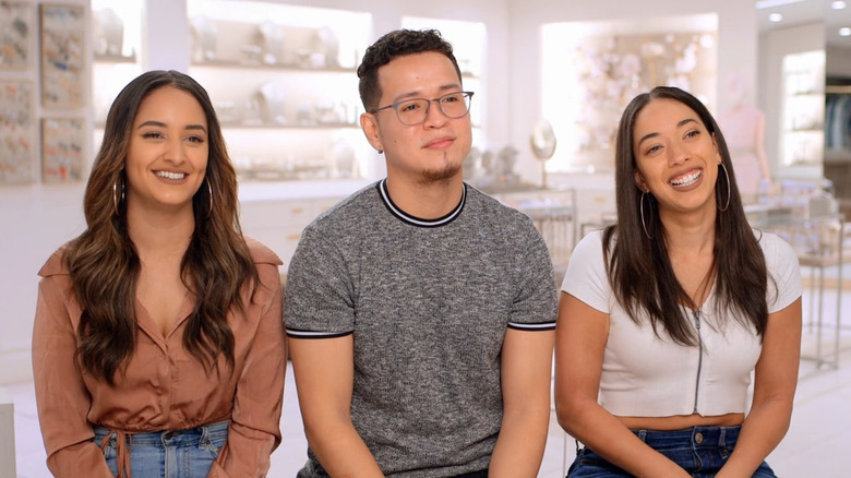 Carly Yashira, Kassandra Lee Diaz, and Paoulo Quispilaya smiling while filming "Say Yes to the Dress"